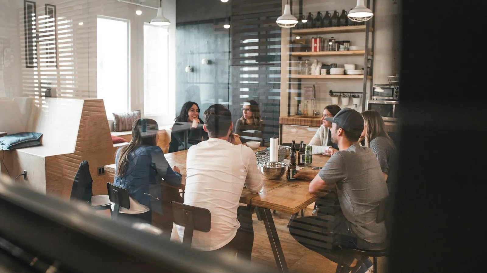 A team discussing ideas during a meeting in a bright office.